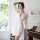 A woman poses elegantly in a sheer white robe set featuring lace sleeves, perfect for intimate sleepwear or lounge wear. the ...
