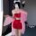 A woman poses in a red bodysuit paired with a sheer pink robe, embodying a fox spirit theme. the set features intricate desig...