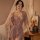 Woman wearing qing lian yi plus size lingerie set with lace-trimmed slip dress and matching robe, posed in soft bedroom setti...