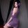 A woman poses elegantly in a purple qing ran sensual off-shoulder cheongsam, featuring lace detailing and frog buttons. the d...