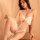Woman modeling qingran plus size lace sleepwear set with butterfly bow, underwire support, and push-up design in soft lightin...