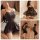 Woman modeling qingran lace ice silk sleepwear set with sheer tight-fit dress and open-crotch design in bedroom setting.