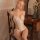 Woman wearing qingran sexy lace bodysuit, sheer cut-out lingerie set with floral details, elegant and bold plus size design.