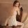 Woman wearing qingran sexy lingerie sleepwear set – open-crotch nightgown with sheer mesh, bow detail & peekaboo bust design.