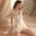Woman wearing qingran sexy lingerie sleepwear set – open-crotch nightgown with sheer mesh, bow detail & peekaboo bust design.