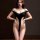 Woman modeling black open-crotch bodysuit lingerie with off-shoulder design and plunging neckline.