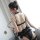 Woman wearing qingran black lace bridal garter set with sheer chiffon thong and floral trim, back view showing delicate strap...