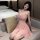 A woman poses elegantly in a soft pink qingran womens seductive lingerie set, featuring lace sleepwear with adjustable straps...