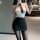 Woman wearing qingruohan milk silk bodysuit, a sexy secretary uniform outfit with white top, black skirt, and tie.