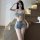 Woman modeling qingruohan sexy denim lingerie set with cutout shorts and bra, perfect for bedroom play and roleplay.