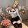 Blonde model wearing qingruohan sexy lingerie set, a white bodycon dress with black accents and thigh-highs.