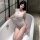 Woman in bathtub wearing qingruohan sheer mesh bodysuit with cutouts and thong design.