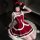 Red christmas dress with white fur trim, featuring a bow and strap top, perfect for new year party outfits.