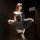 Elegant black lace teddy dress with sheer tulle skirt, perfect for women seeking pure yet forbidden allure.