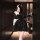 Elegant black velvet dress with sparkling details, perfect for evening events. features a strapless bodice and flowing skirt ...