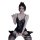 Woman modeling black lace mesh bodysuit with sheer stockings, featuring floral details and bow accent.