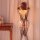 Woman wearing qingyege plus size mesh bodysuit with sheer open-crotch design and attached stockings, back view.