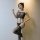 Woman wearing qingyege sheer mesh bodysuit with open-crotch design and striped stockings, posing elegantly against a soft-lit...