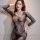 Woman wearing qingyege sexy mesh lingerie set with sheer stockings, bold floral design, plus size bedroom outfit.