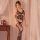 Woman modeling qingyege black lace bodystocking with open-crotch and thigh-high mesh design, sheer seductive lingerie.