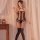 Woman modeling qingyege transparent halter bodysuit with open-crotch design and thigh-high stockings, sheer mesh lingerie.