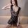 Woman wearing black mesh bodysuit with lace details, sitting on beige couch. qingyeguo sexy mesh bodysuit set - tear-away pas...
