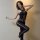 Woman modeling qingyeguo sexy sheer bodysuit with lace trim, open-crotch tights, ultra-thin and breathable design.