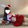 Woman lounging on a couch in a qqny christmas sexy bunny girl dress costume set, featuring a red and white outfit with bunny ...