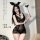 Woman wearing black qqny deep v lace lingerie set with bunny ears and heart wand, sheer bodycon mini dress style.