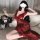 Woman in red qqny plus size lace sleep dress, sheer lingerie set, holding wine glass with roses nearby.