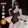 Woman modeling black lace qqny pure allure sleepwear set, elegant sensual nightwear with premium soft fabric.