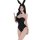 Woman in black bunny costume with white collar and bow tie, posing elegantly against white background.