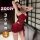 Woman modeling burgundy qqny pure allure sleepwear set, elegant lingerie with lace bodice and satin wrap skirt.