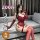 Elegant sensual lingerie set featuring a form-fitting bodice and thigh-high stockings, perfect for luxury bedroom wear.