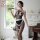 Elegant sensual black fishnet lingerie set with lace trimmings, perfect for luxury bedroom wear.