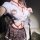 Woman wearing qqny pure allure sleepwear set with white blouse, plaid skirt, and red rope accents for elegant sensual lingeri...