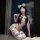 Woman in qqny pure allure sleepwear set, elegant sensual lingerie with bow details and thigh-highs, luxury bedroom wear.