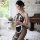 Elegant sensual lingerie set featuring fishnet bodice and lace-trimmed apron, perfect for luxury bedroom wear.
