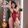 Woman modeling red lace qqny pure allure sleepwear set, elegant seductive lingerie with sheer panels and delicate straps.