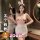 Woman modeling qqny pure allure sleepwear set – elegant pink lingerie with bunny ears, lace trim, and bow accents in a luxuri...