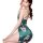 Woman wearing qqny pure allure sleepwear set – elegant green floral lingerie with open back and thigh-high slit.