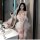 Elegant white lace sleepwear set with sheer fabric and delicate ruffles, perfect for luxurious sensual evening wear.