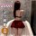 Woman wearing qqny pure allure burgundy lingerie set with skirt, back view in bathtub.