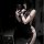 Woman in qqny pure & sexy knotted neckline sleep dress, body-con nightwear for date nights and lounge wear, posing with phone...