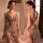 A woman poses in a sheer, sparkling nightdress with a halter neck design, featuring a backless style and lace detailing. the ...