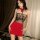 Woman wearing qqny pure temptation lingerie set with red skirt and lace top, styled as a sexy bedside secretary sleepwear out...