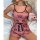 A woman lounges on a fluffy rug wearing a pink qqny pure temptation lingerie set adorned with crown patterns, holding a pink ...