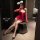 Woman in red christmas lingerie set with bunny ears, posing seductively on stool — pure & tempting sexy sleepwear, naughty un...