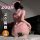Woman in pink qqny seductive lounge set kneeling on bed, showcasing luxury sensual nightwear from pure desire collection.