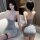 Woman wearing qqny silver glitter maid lingerie set with lace halter top, fishnet stockings, and backless mini dress design.
